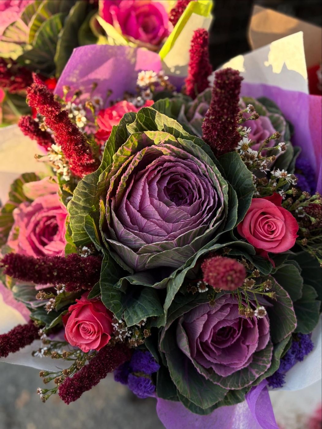 Autumn bouquet with ornamental kale and warm colored blooms from Thai D Garden